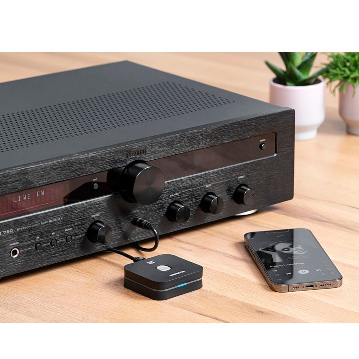 BoomBoom 80 - Bluetooth Receiver - Ambiance Image of a BoomBoom 80 Connected to an AV Receiver and Smartphone Streaming Music | Marmitek