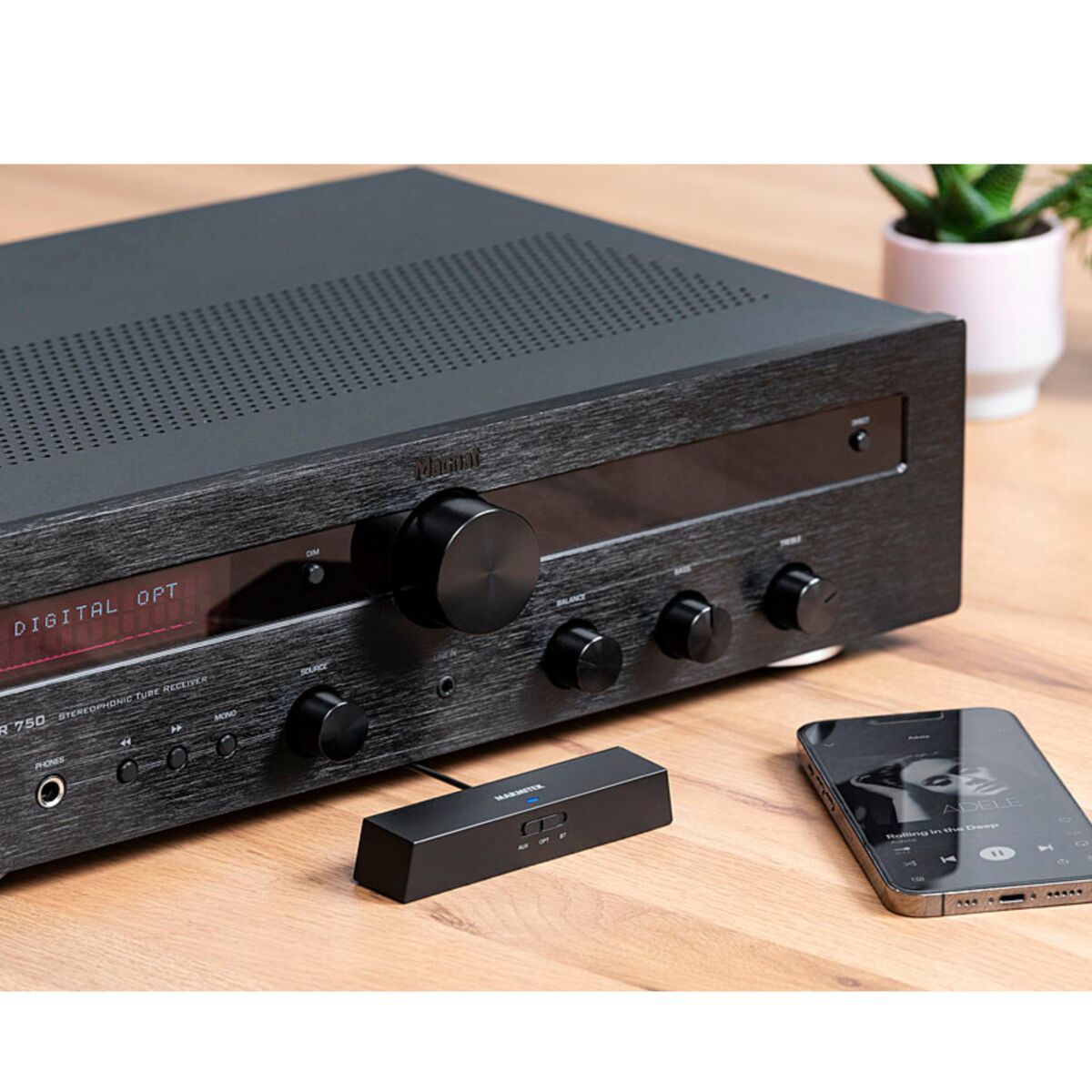 BoomBoom 100 - Bluetooth Transmitter and Bluetooth Receiver - Ambiance Image of a BoomBoom 100 connected to an AV Receiver and Smartphone Streaming Music | Marmitek