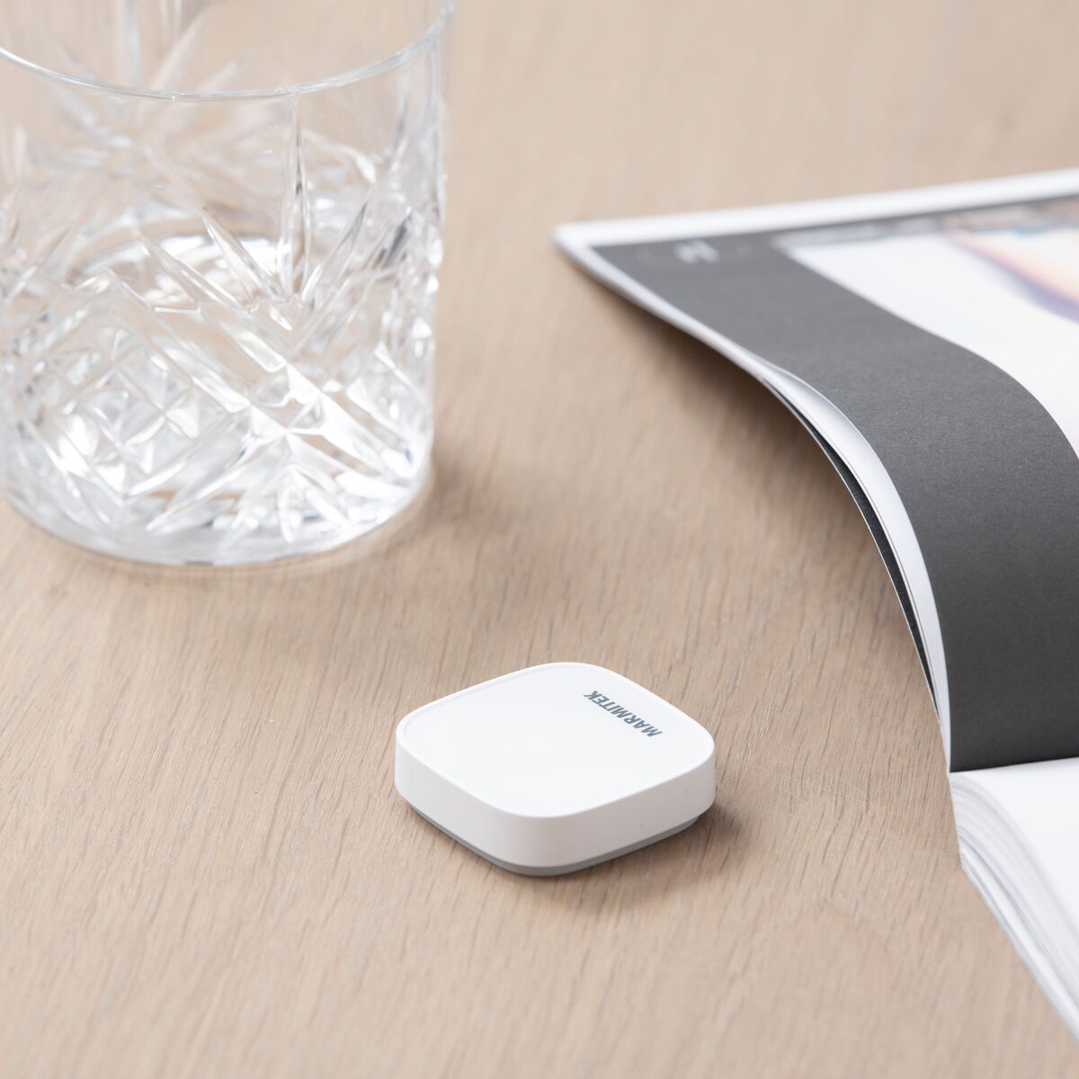 Push ME - Zigbee switch - Ambiance Image of Push ME lying on table | Marmitek