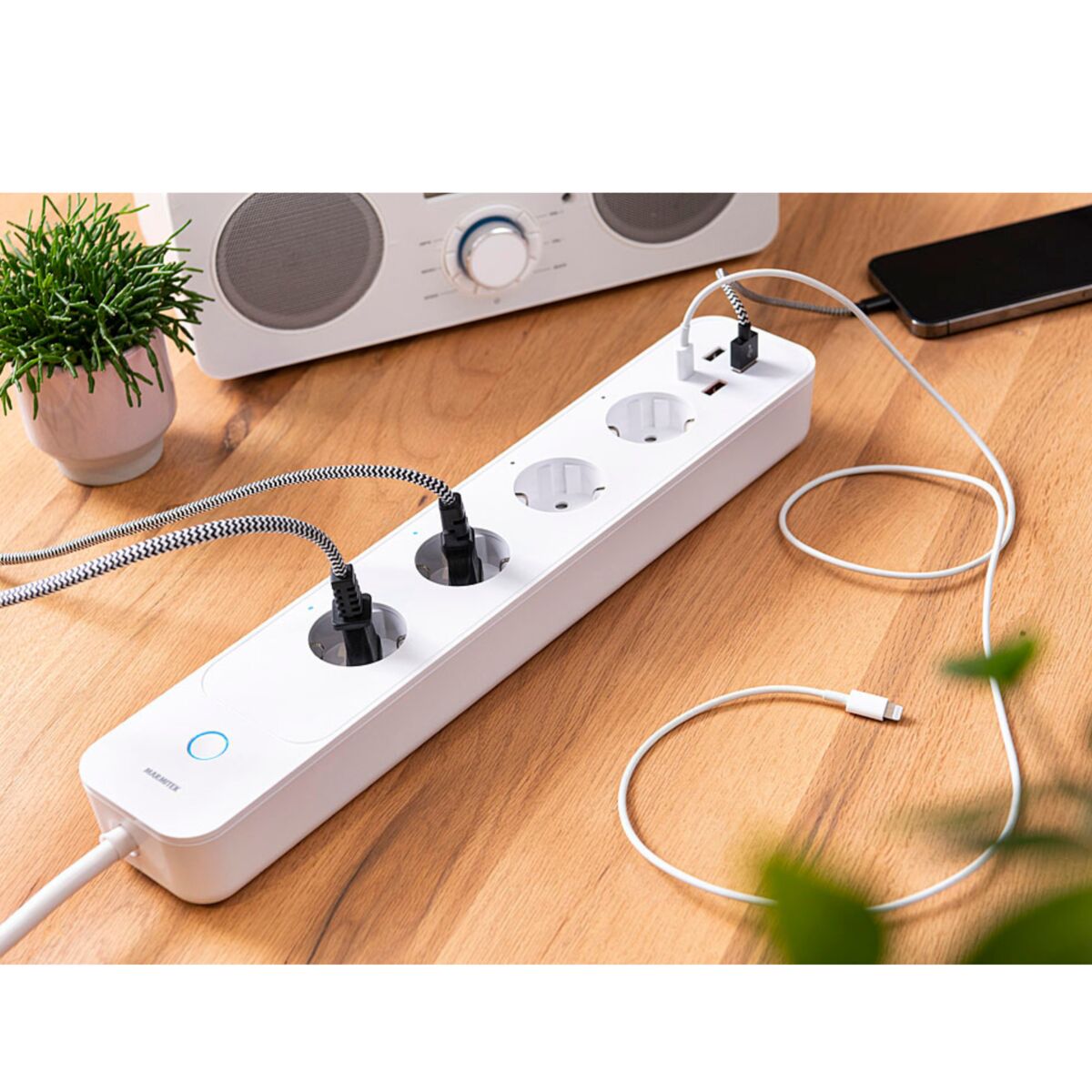 Power LI - Smart power strip - Ambiance Image of power LI with several power plugs in sockets | Marmitek | Marmitek