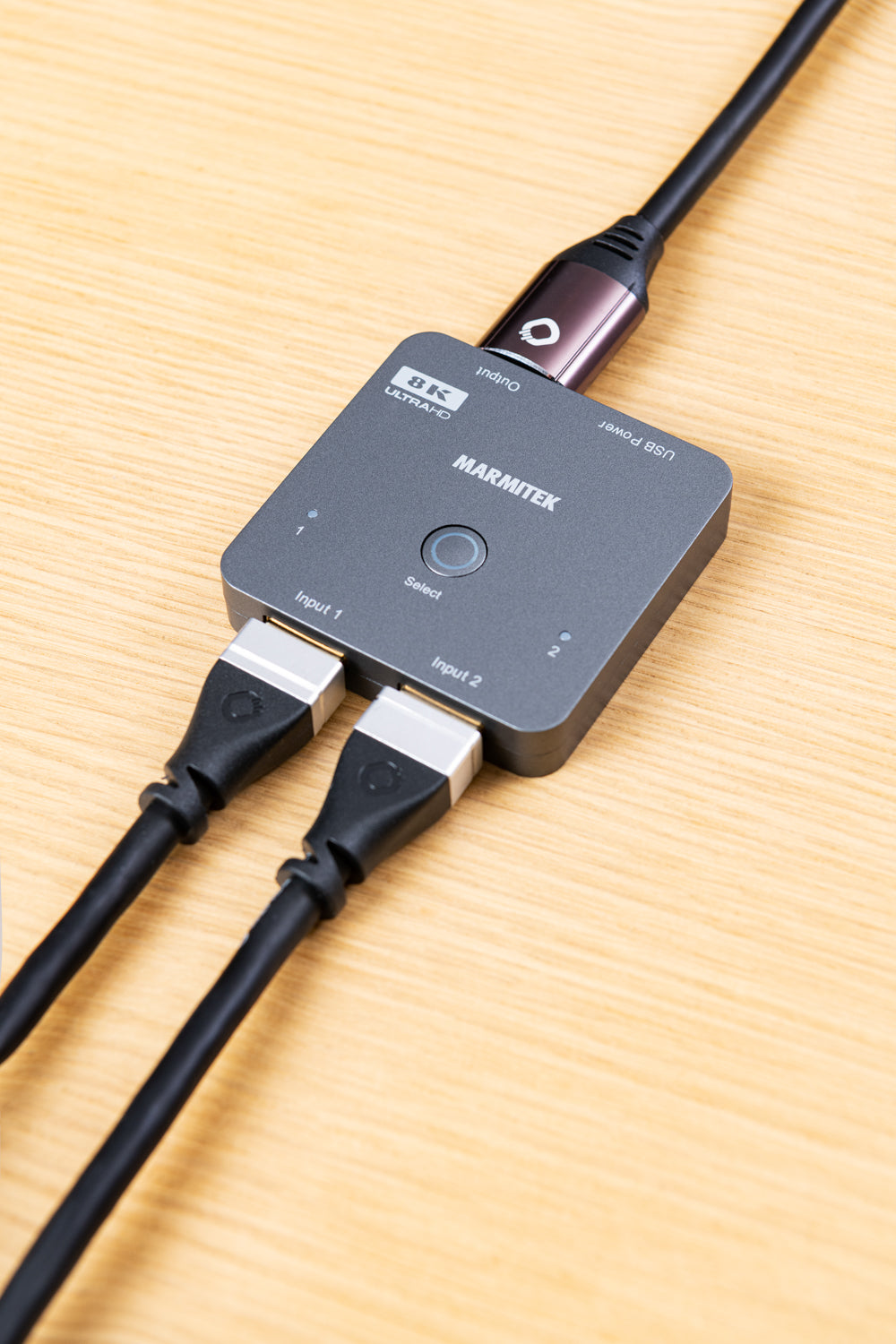 HDMI switch with HDMI cables in INPUT and OUTPUT