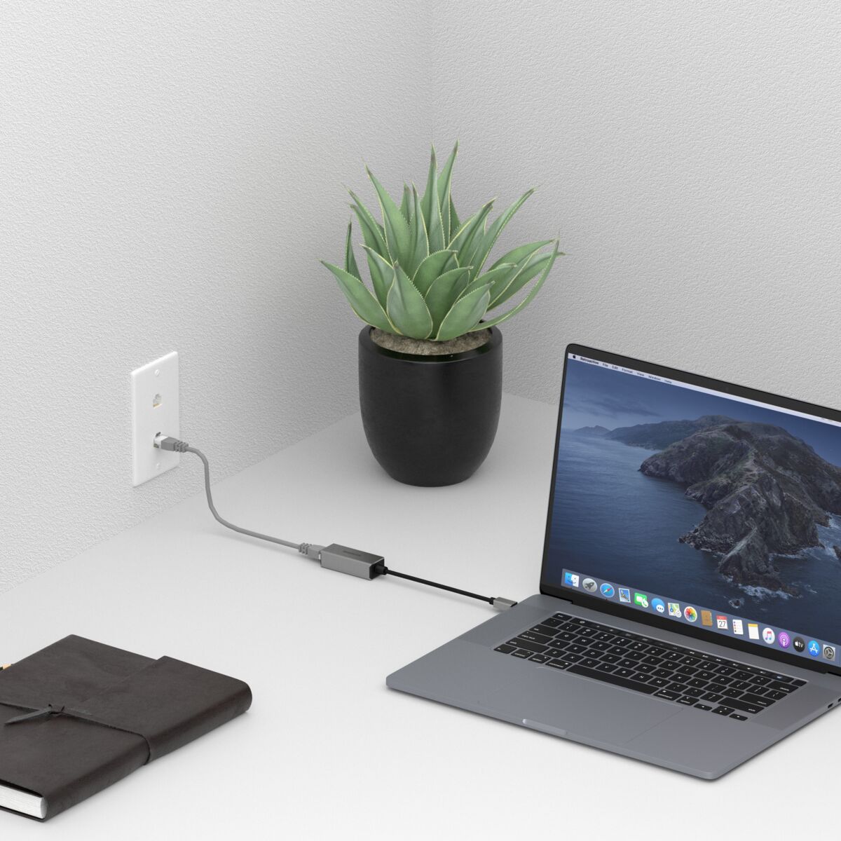 USB-C to Ethernet adapter - Ambiance Image of a laptop connected directly to network using an USB-C to Ethernet adapter | Marmitek