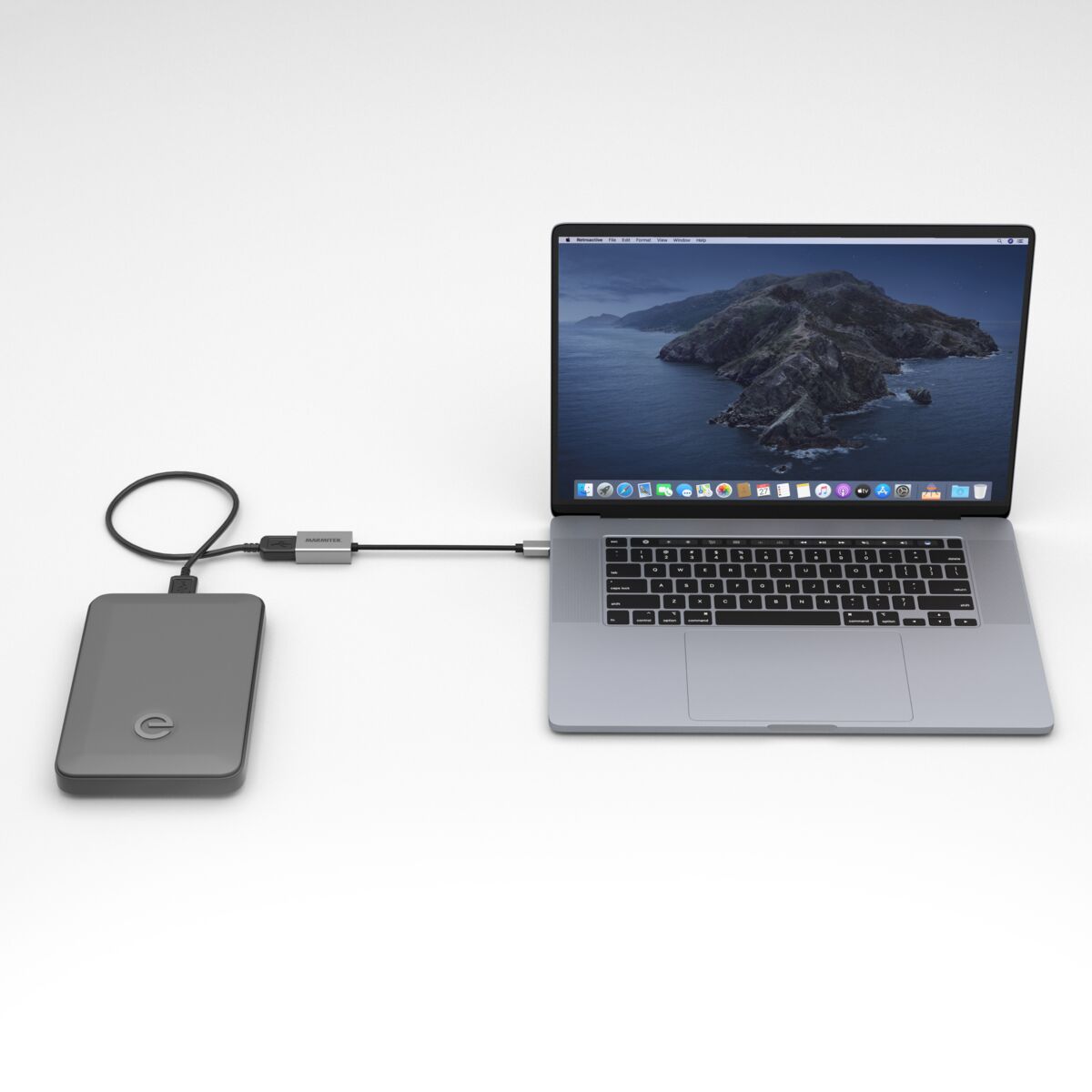 USB-C to USB-A adapter - Ambiance Image of an external hard disk connected to a laptop using an USB-C to USB-A adapter | Marmitek
